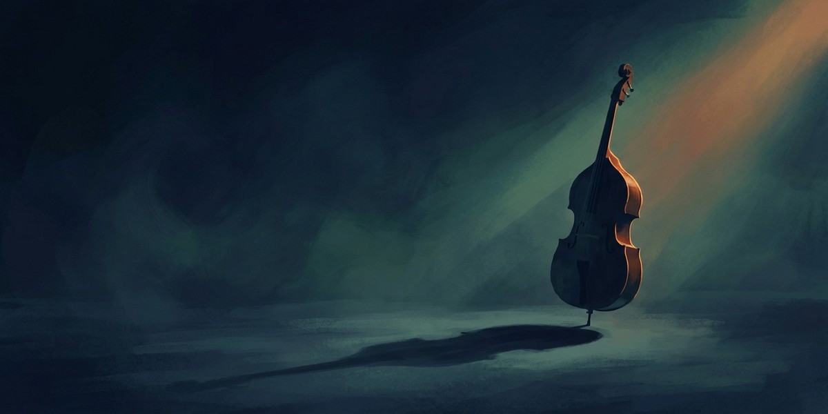 A lone upright bass standing in a shaft of light on an empty stage